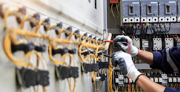 Professional Electrician technician working in Saddle Rock, NY